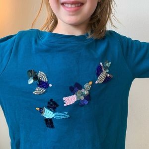Beaded and embroidered birds on kids sweater